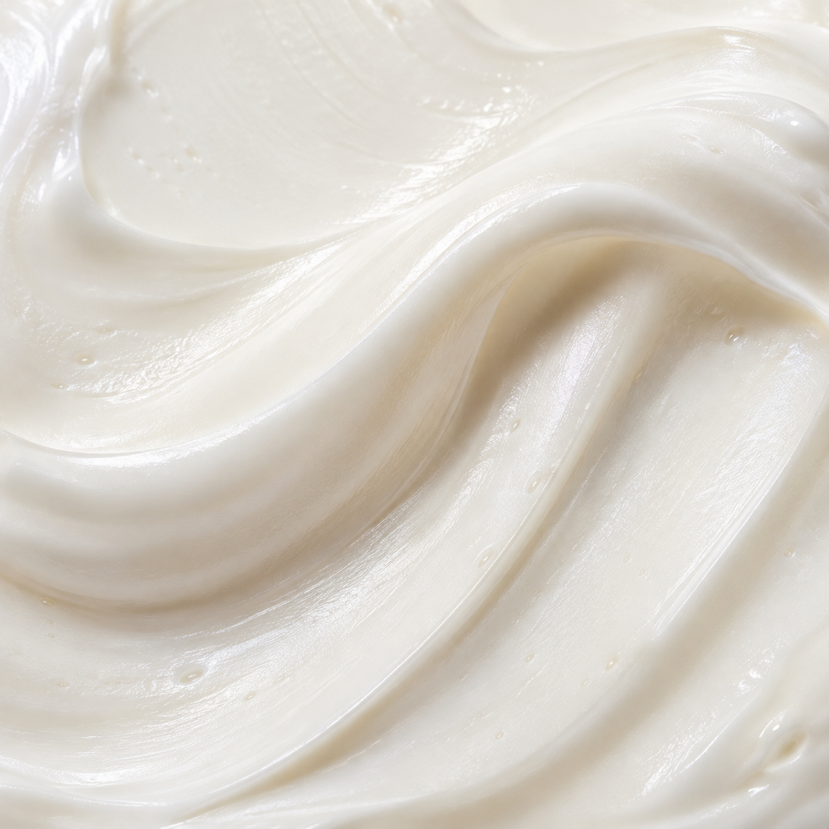 A soft white cream texture viewed up close